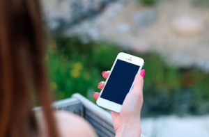 woman holding iPhone