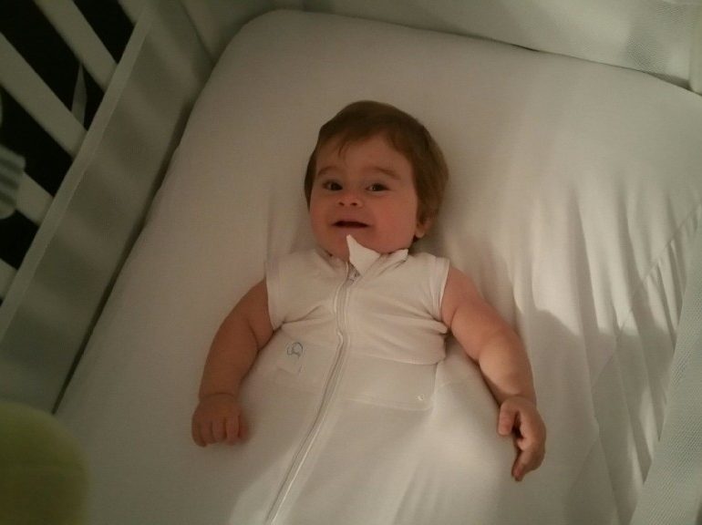 baby sleeps with face in mattress