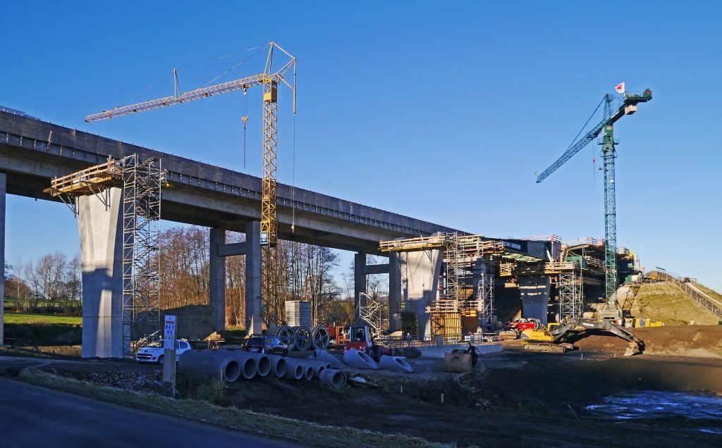 Photo of 2 cranes at construction site