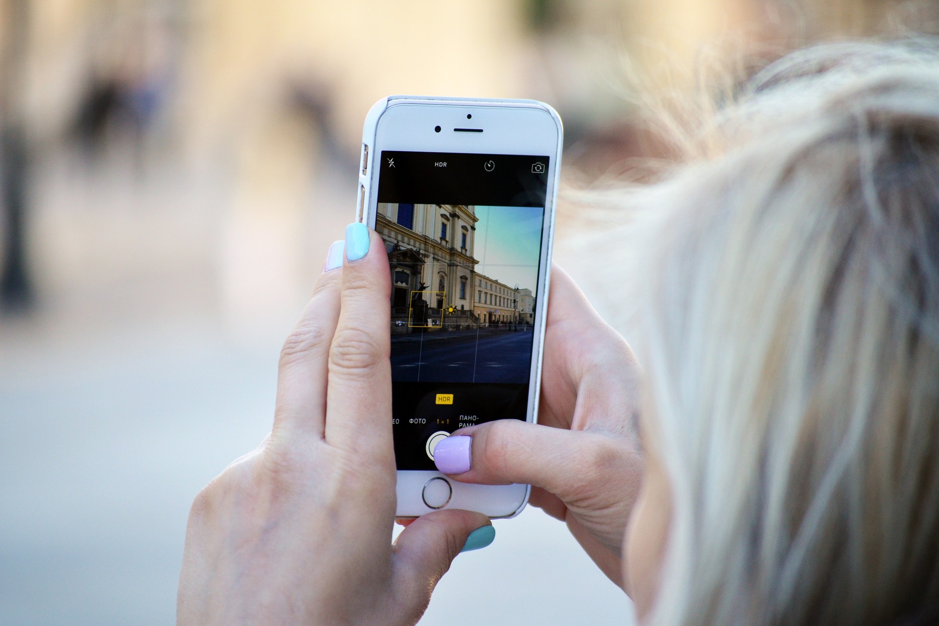 Woman taking photo of a building