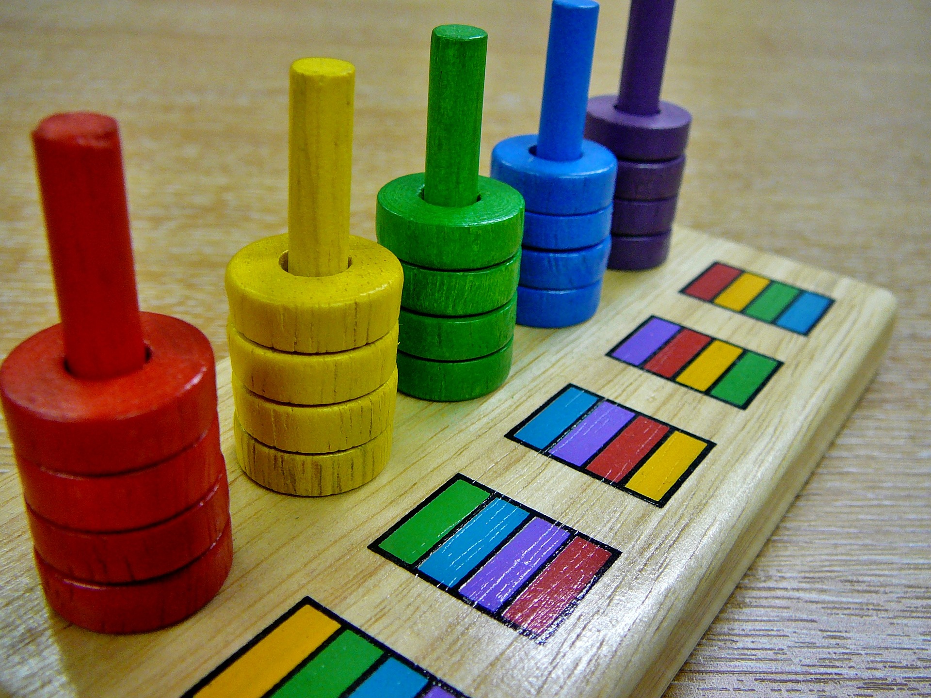 Colored stacking disks logic puzzle