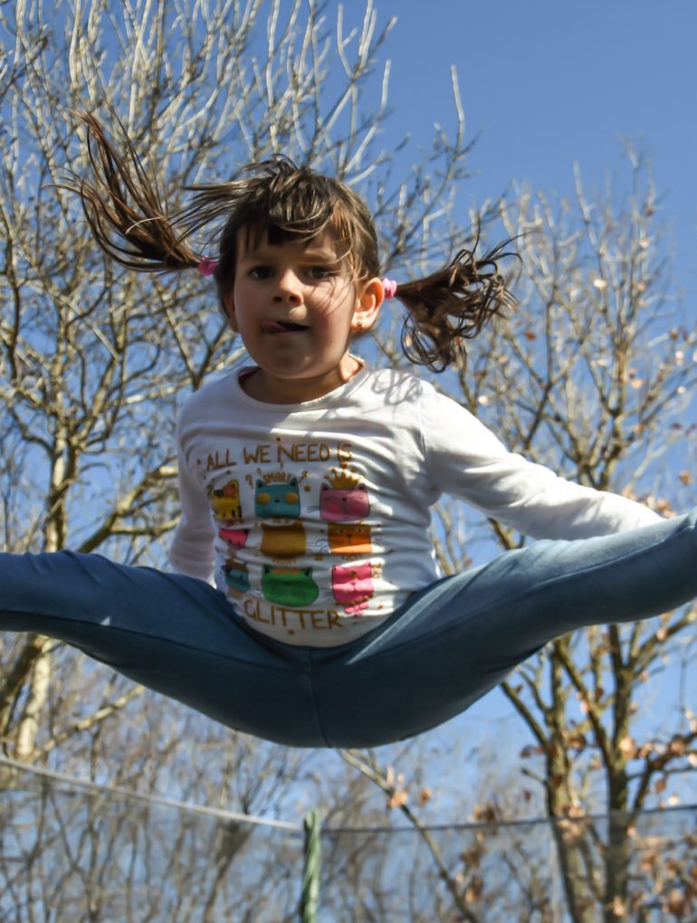 girl jumping outdoors