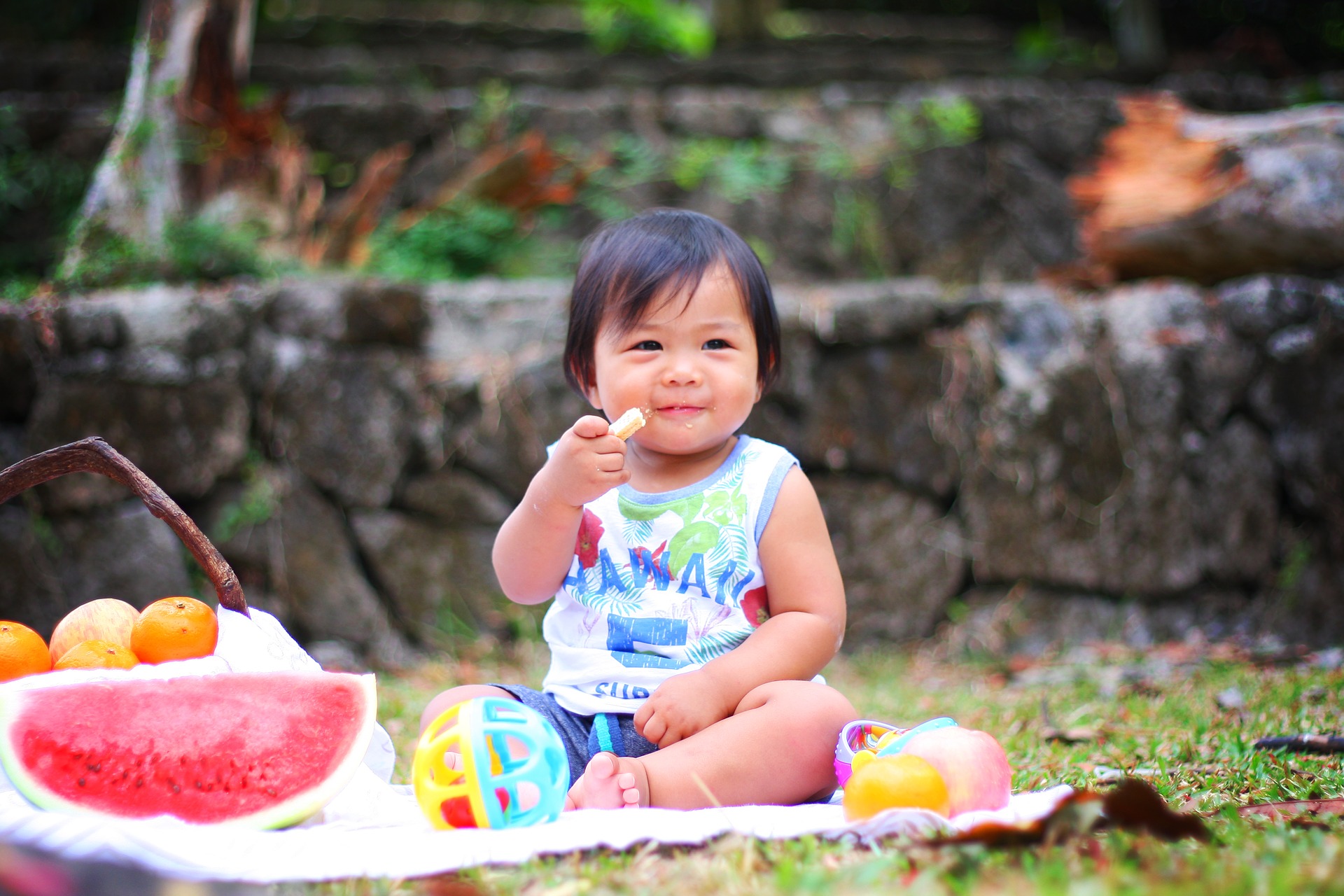 Toddler sitting on the ground