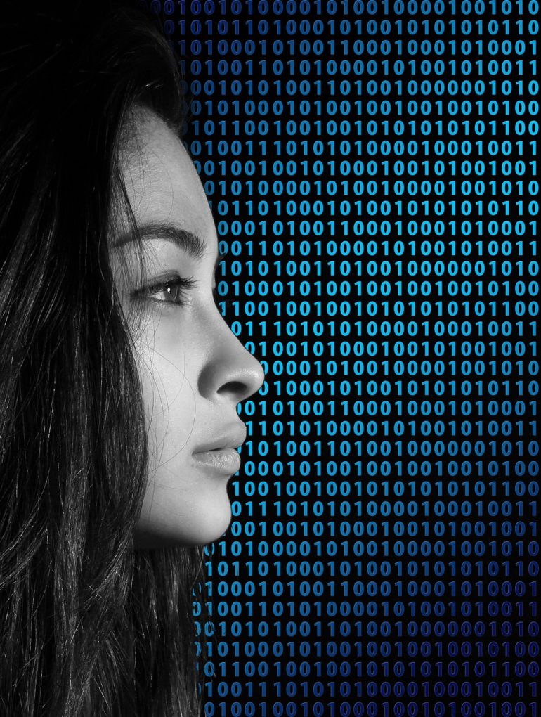 female Silhouette against a background of binary code