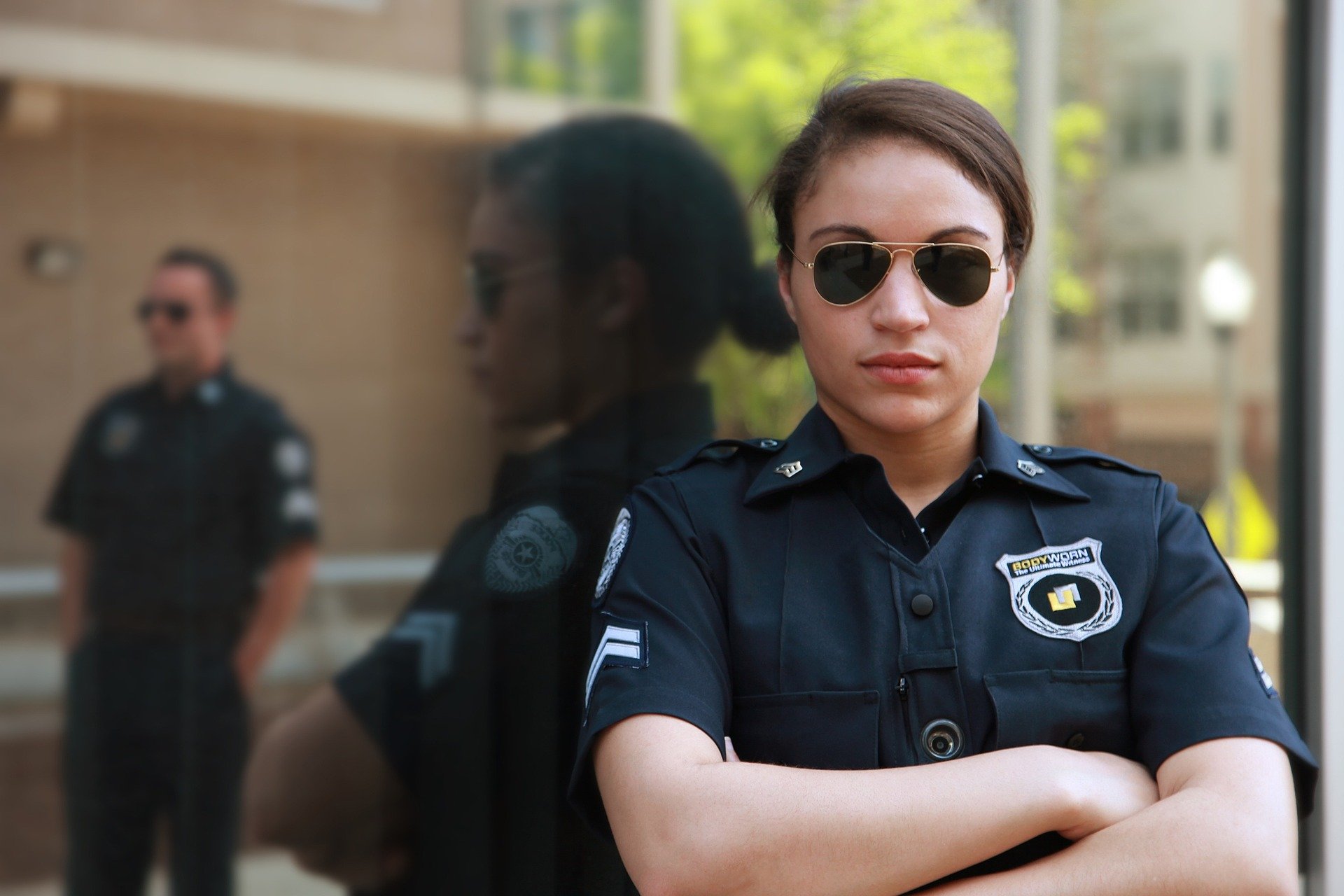 police woman with arms folded